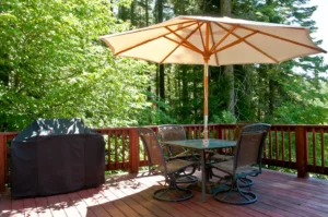 deck with outdoor seating and grill