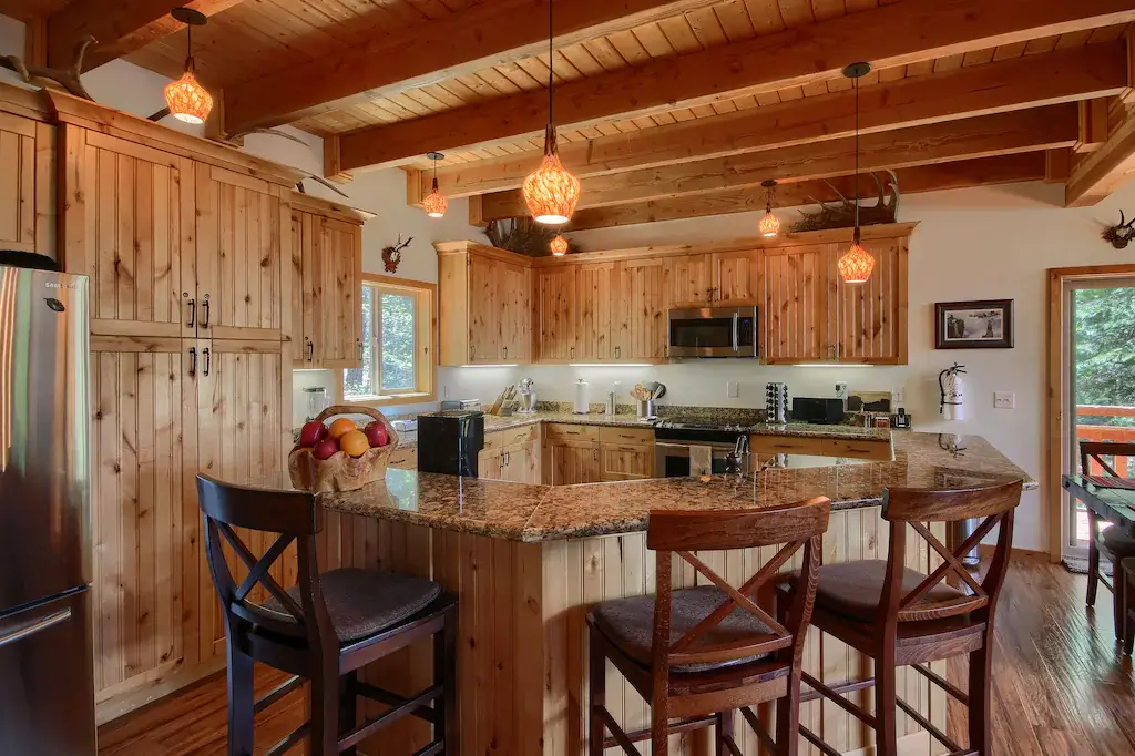 kitchen with bar seating and beams