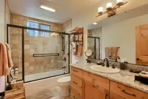 bathroom with shower and tub