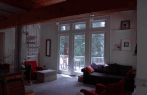 living room with seating and large windows and deck access