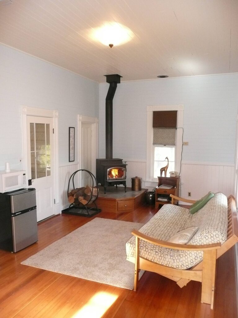 living room with wood stove and seating