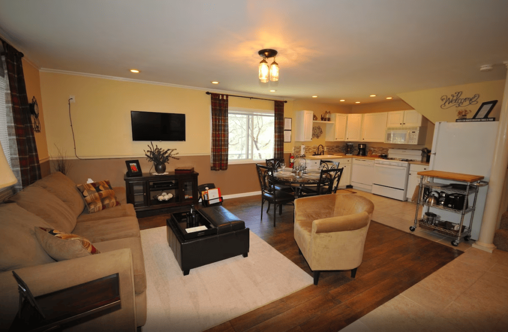 living area with television and seating