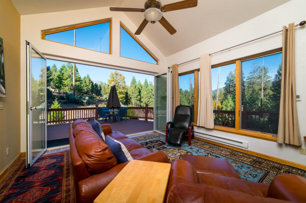 living area with open windows and seating