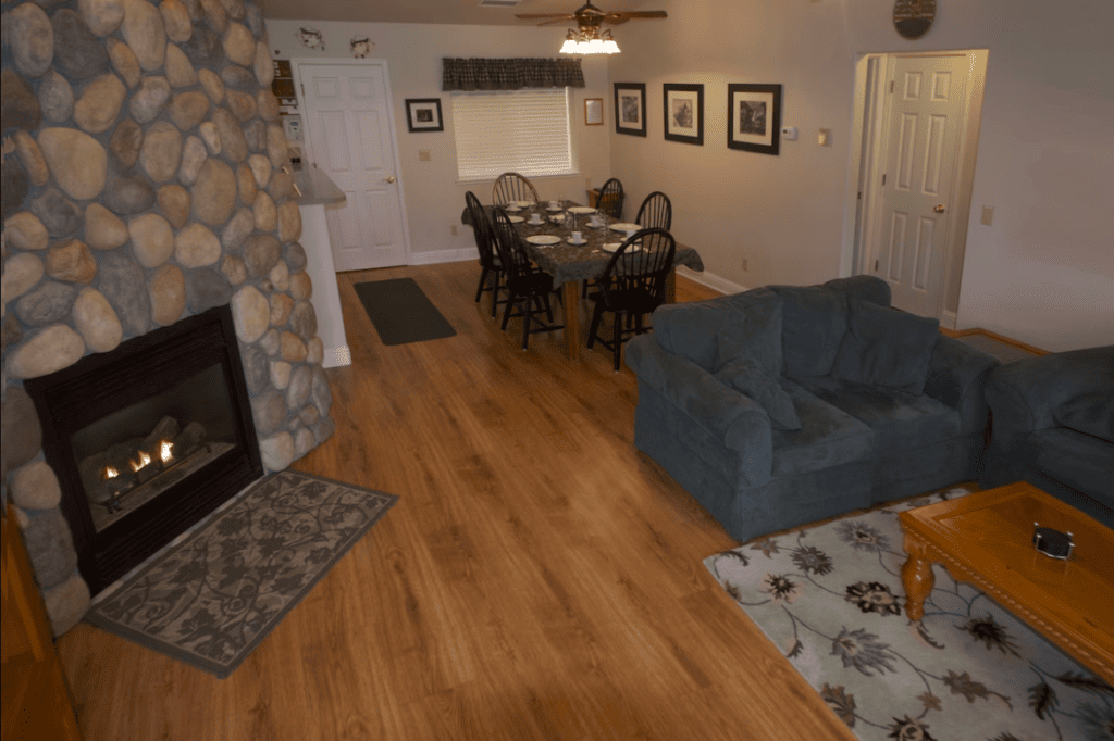 living area with fireplace, couches and dining