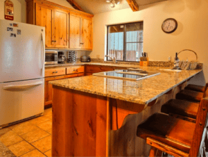 fully equipped kitchen with bar seating