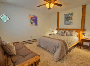 bedroom with queen bed and futon bed