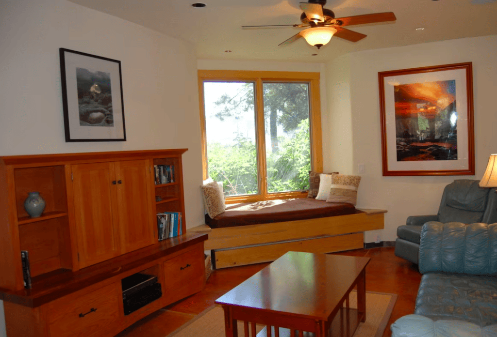 living area with window seat and couches