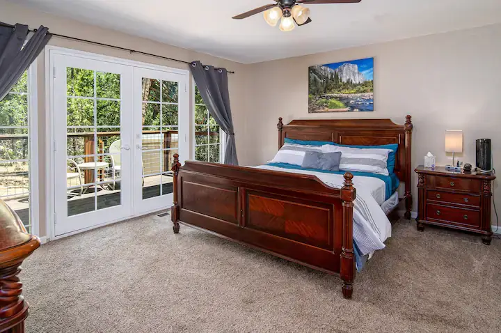 bedroom with king size bed and balcony