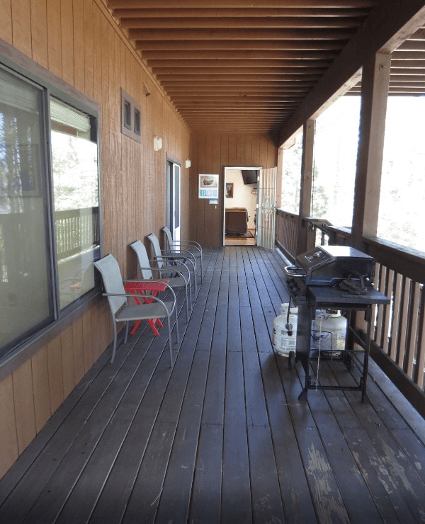 deck with outdoor seating and grill
