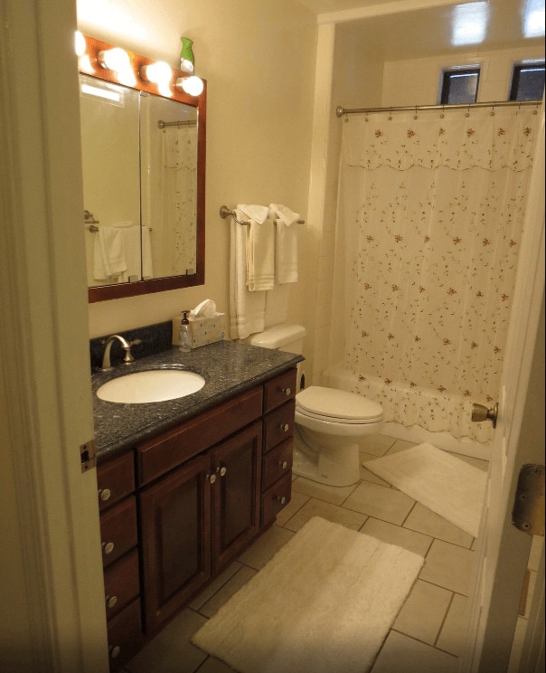 bathroom with bath shower combo