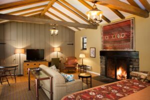 cottage with king bed and fireplace