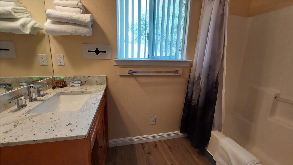 bathroom with shower and bath