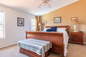 bedroom with wood bed and bench