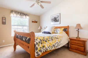 bedroom with wood bed frame