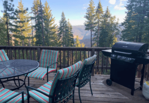 deck with outdoor seating and grill