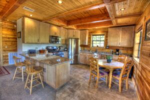 wood paneled kitchen with wood cabinets