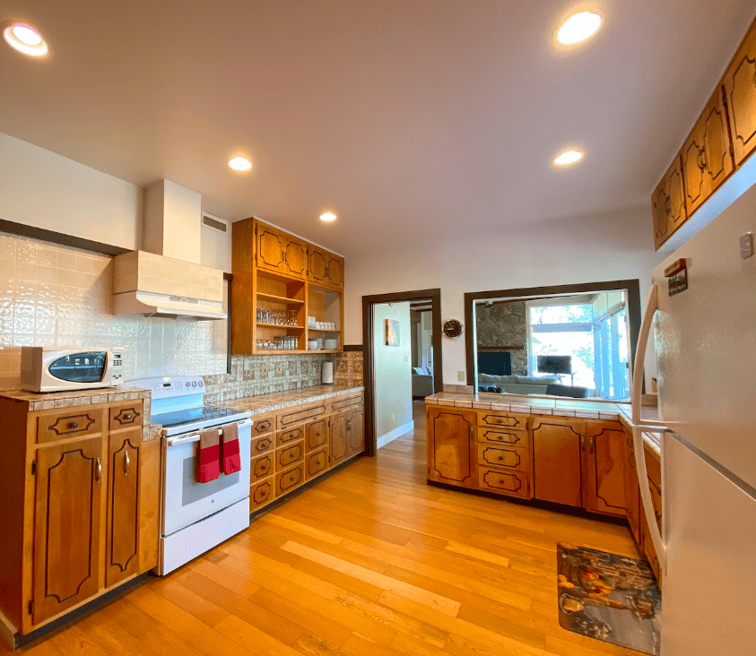 kitchen with wood cabinets and white appliances