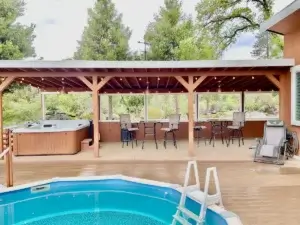 pool with outdoor area and hot tub