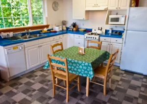 fully equipped kitchen with dining table