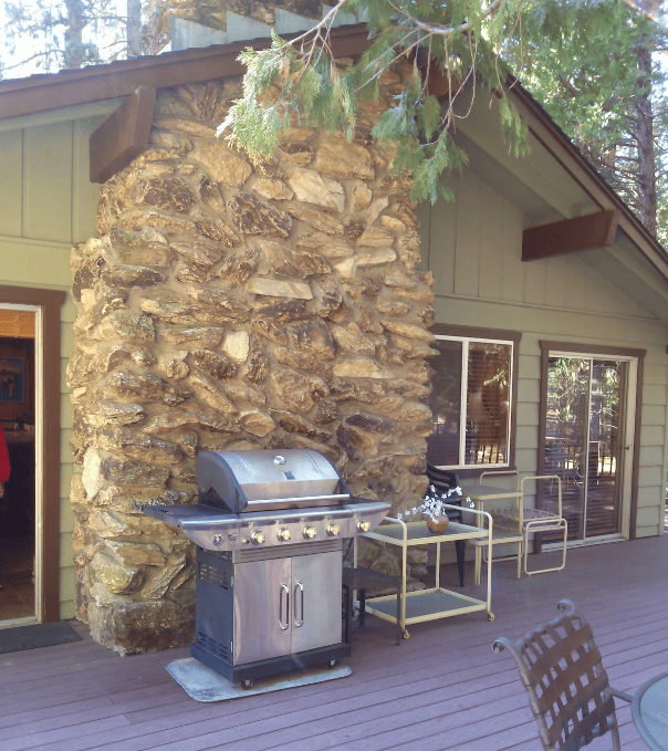 deck view of outside of fireplace and grill