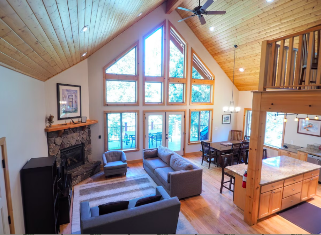 overview of living area with couches and fireplace