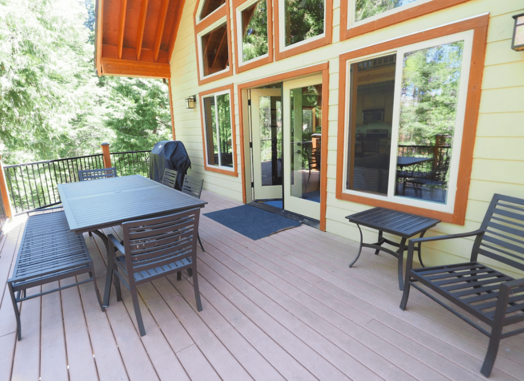 deck with outdoor seating and grill