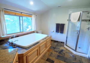 bathroom with shower and spa tub