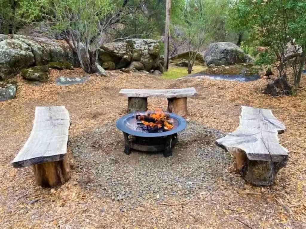 fire pit with wood benches