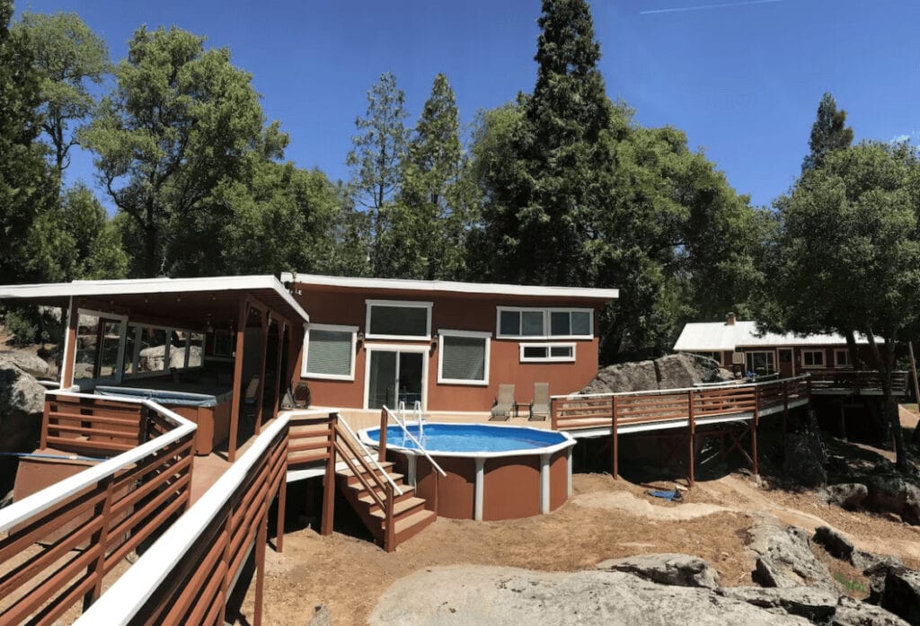 view of pool house and pool