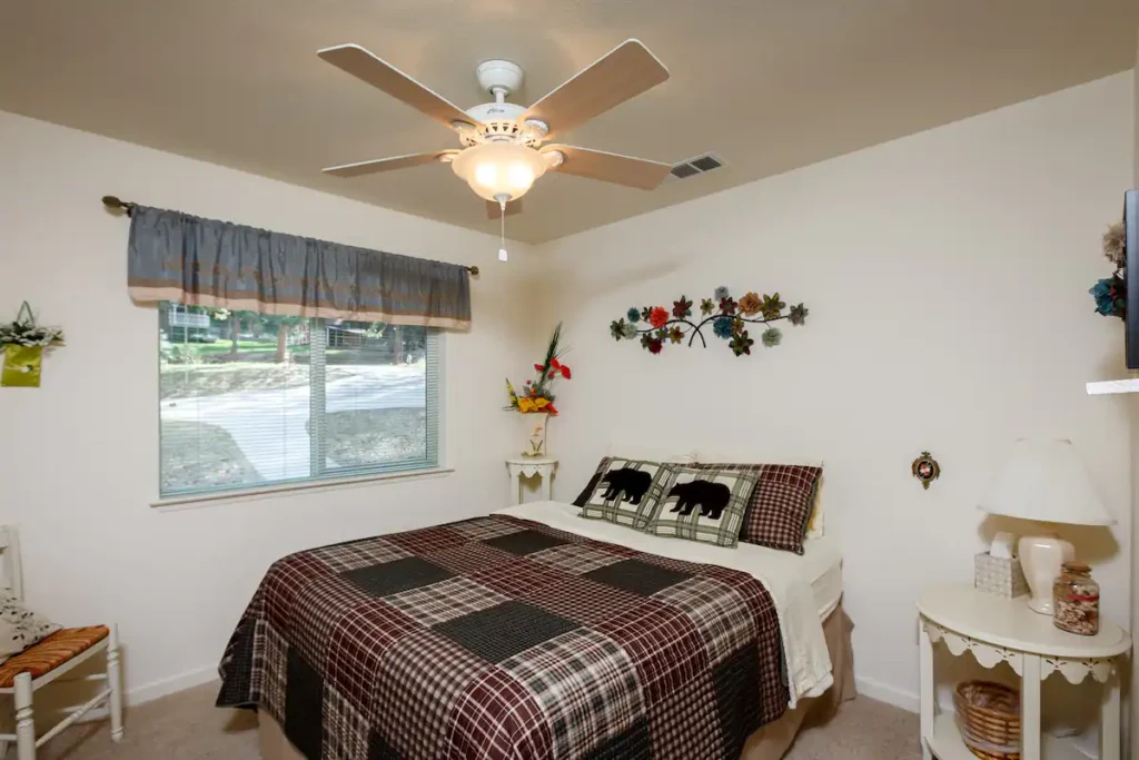 bedroom with queen bed and window