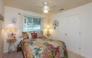 bedroom with queen bed and window