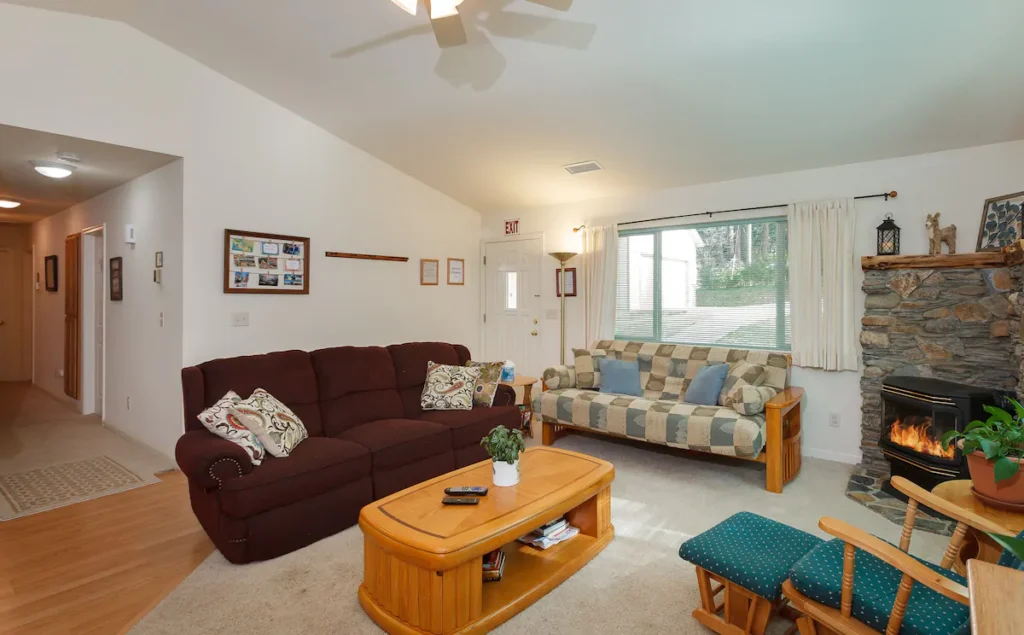 living area with couches and fireplace