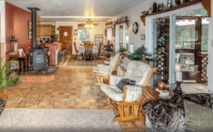 living area with wood stove and seating