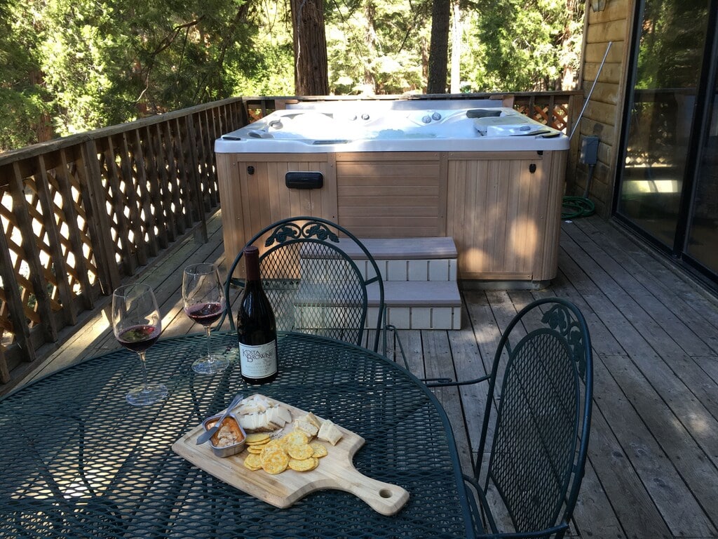 deck with seating and hot tub