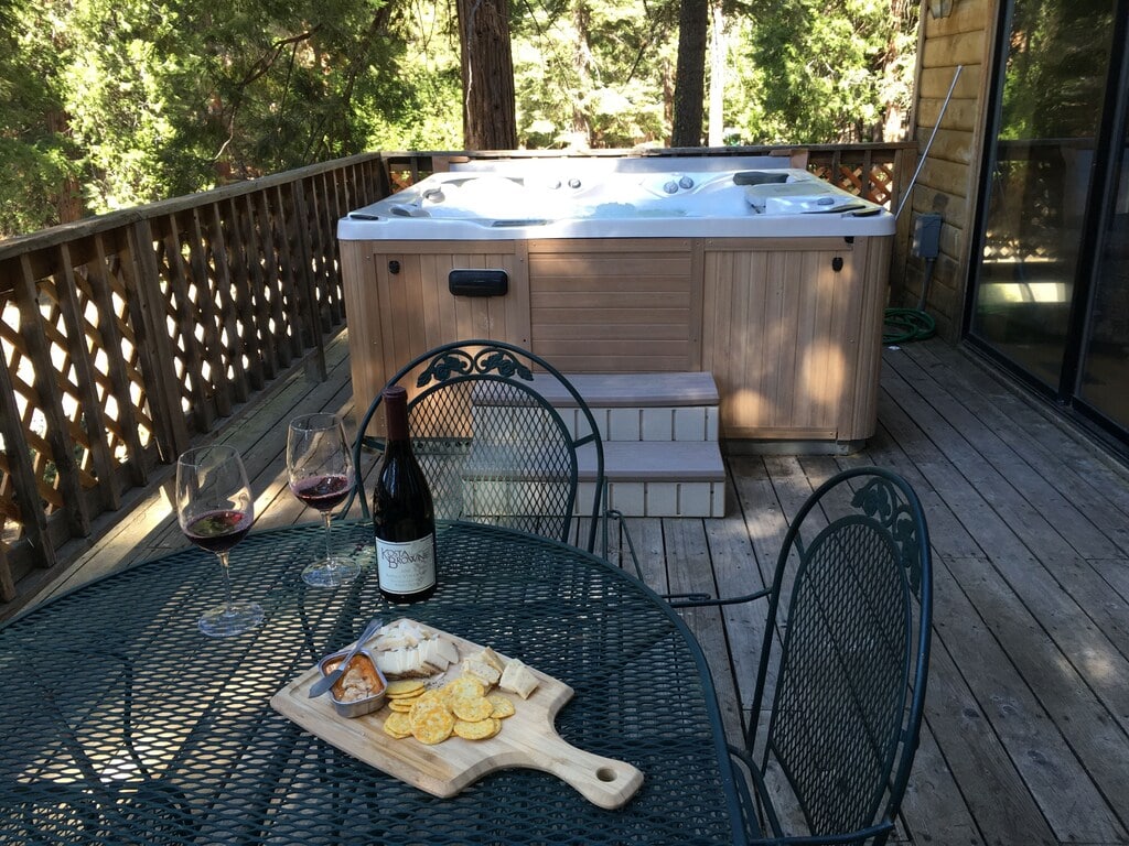 deck with seating and hot tub