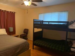 bedroom with queen bed and bunk bed