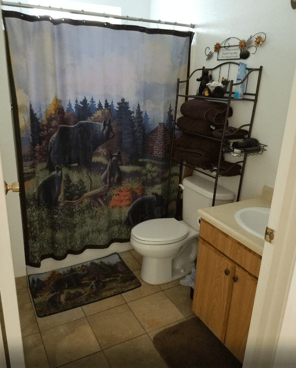 bathroom with bear shower curtain