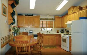 kitchen with wood cabinets and dining area