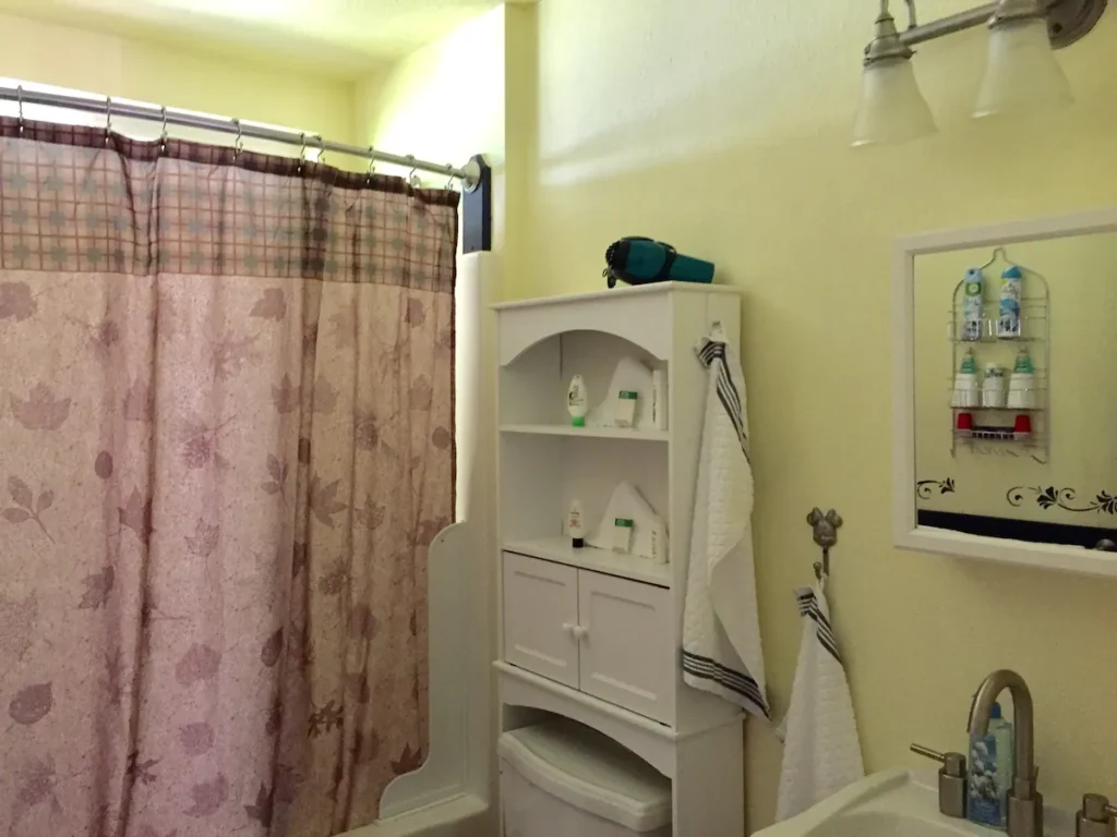 bathroom with shower and tub