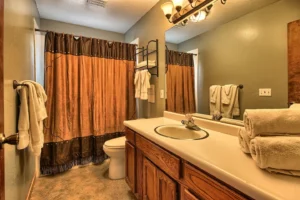 bathroom with shower tub and vanity