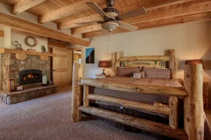primary bedroom with carved wood bed frame