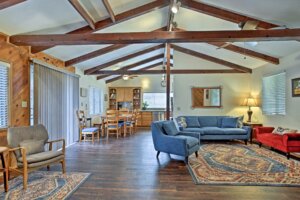 living room with beamed ceilings and blue couches