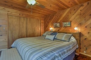 bedroom with wood paneling