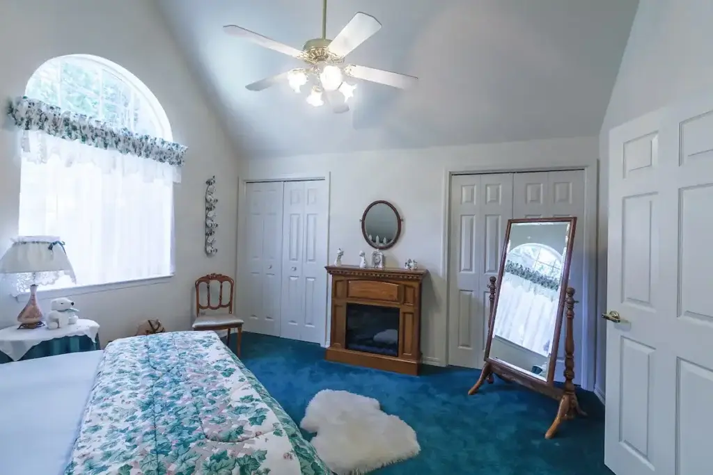 bedroom with electric fireplace