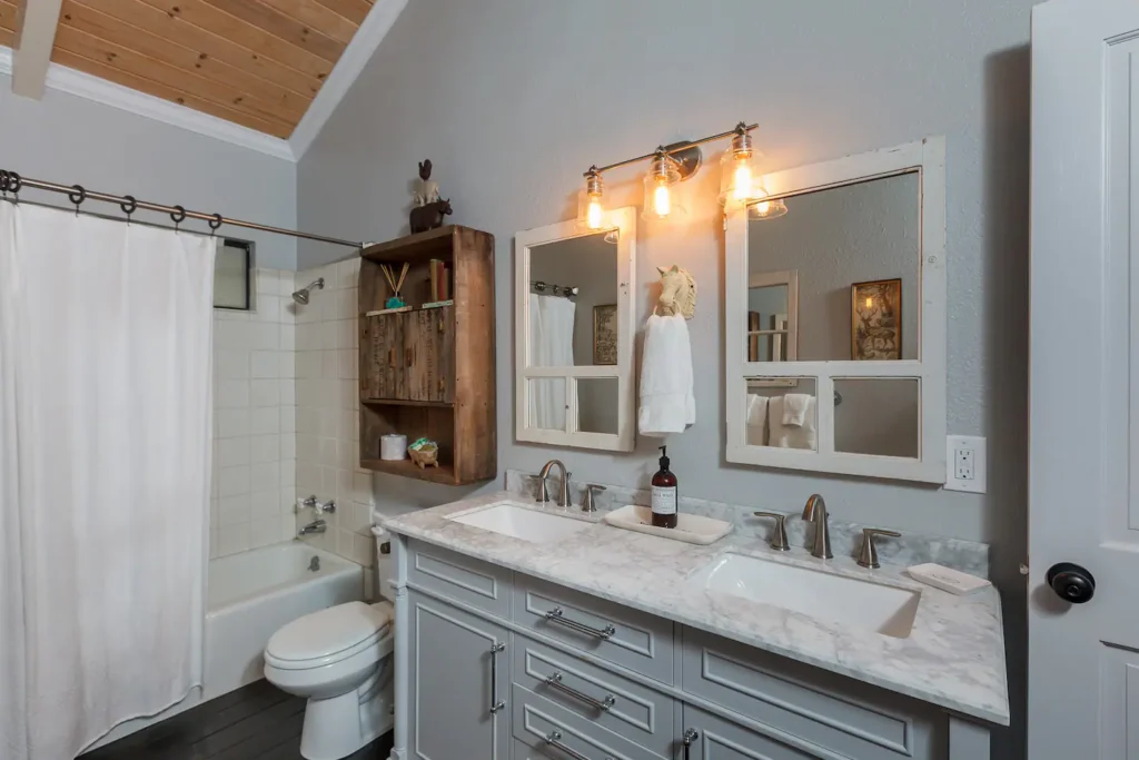 bathroom with vanity and bathtub shower