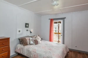 bedroom with white walls and queen bed