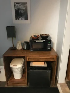kitchenette with microwave and refrigerator