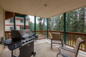 deck with grill and outdoor seating