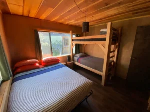 bedroom with queen bed and bunk beds