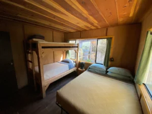 bedroom with queen bed and bunk beds